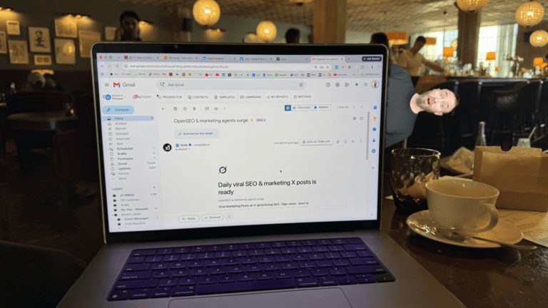 Alt text: MacBook in a cafe displaying a Gmail notification from Grok that “Daily viral SEO & marketing 𝕏 posts” is ready, illustrating the automation used to find viral 𝕏 posts for short-form video ideas.