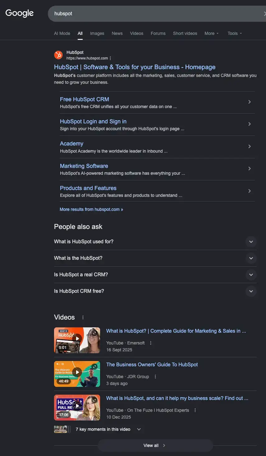 Google search results page for “hubspot” showing HubSpot’s homepage, sitelinks, People also ask, and a prominent Videos section, supporting my point that competitor brand searches often show video content near the top.