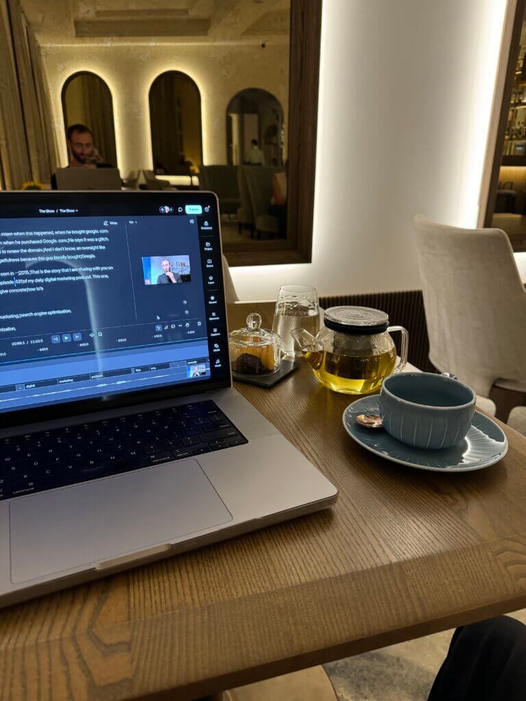 Edward Sturm in the Grand Hotel Vilnius café with tea, cookies, and his laptop.