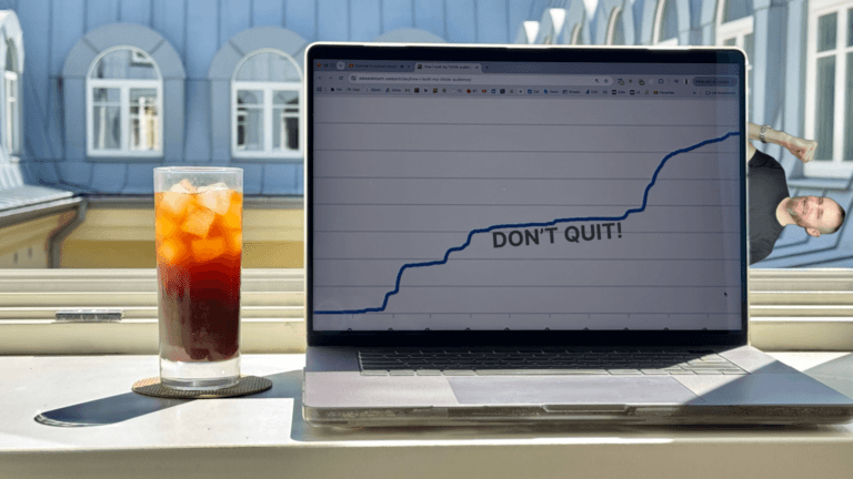 Laptop showing an upward growth chart with “DON’T QUIT!” on the screen, representing how persistence and small marketing tweaks can lead to breakthrough growth.