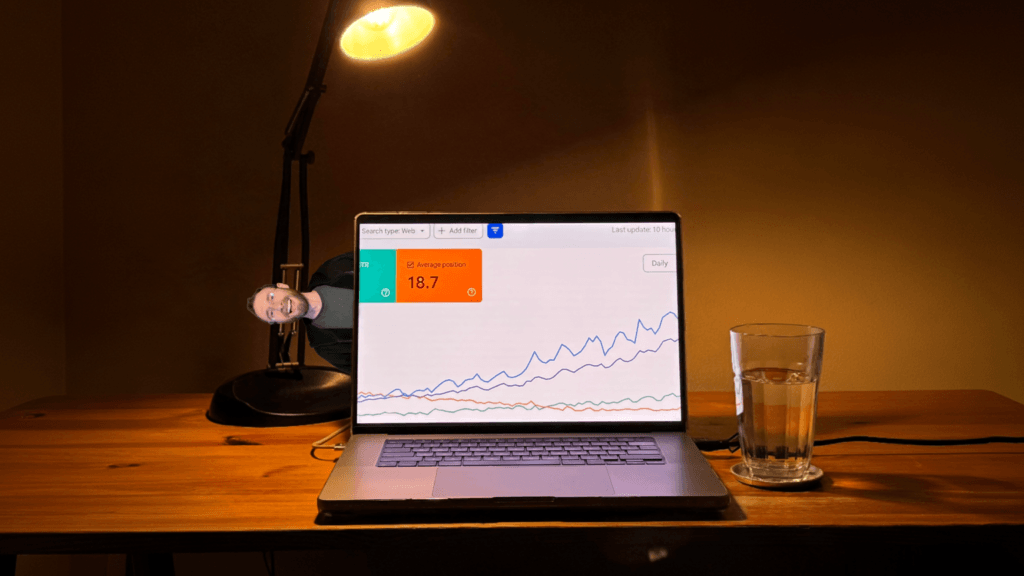 Laptop showing rising Google Search Console rankings, illustrating how to rank faster by using the topical authority your website already has.