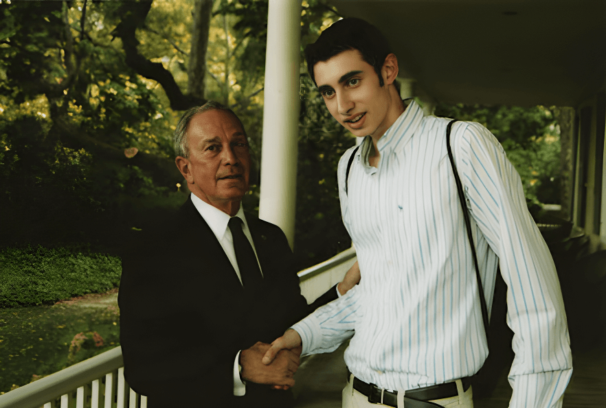 Edward Sturm shaking hands with Michael Bloomberg - upscaled with face enhance