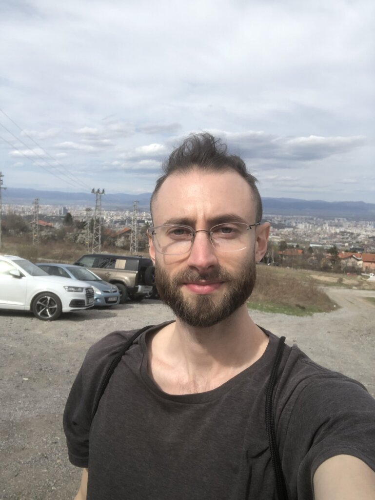 Edward Sturm hiking, at a lookout on Mount Vitosha. Photo taken in Sofia, Bulgaria in 2022.