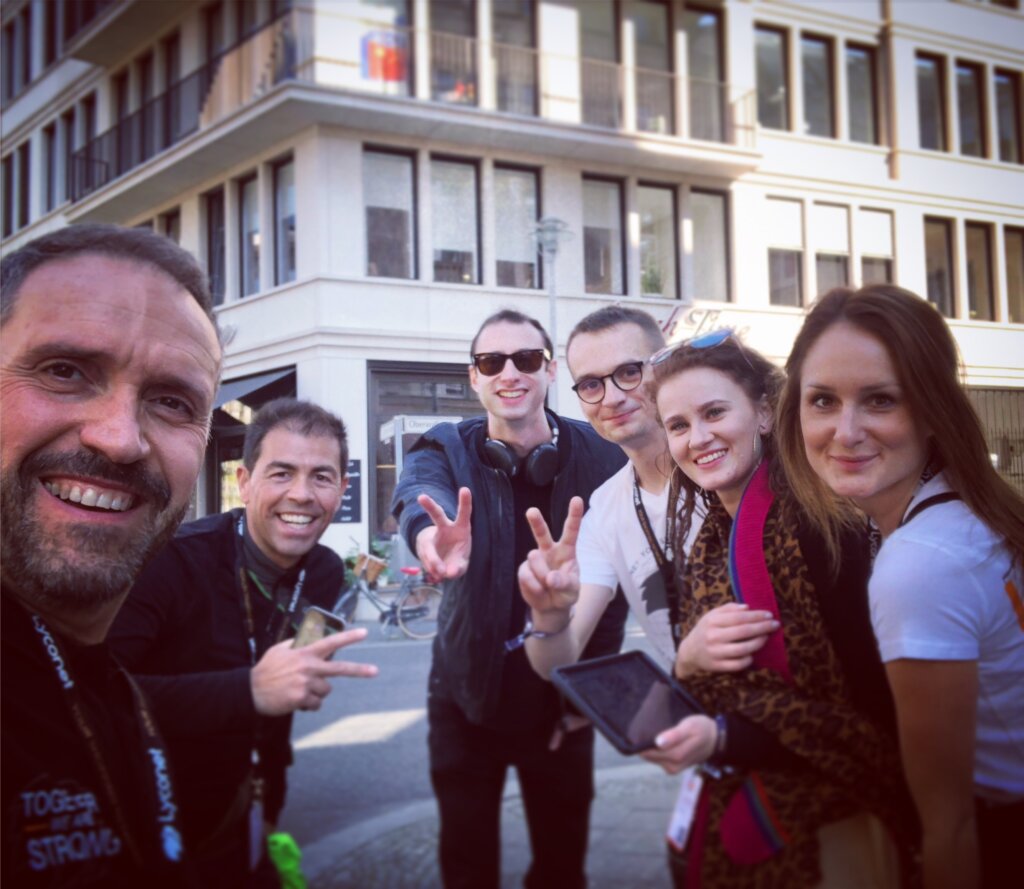 Edward Sturm, smiling, with friends in Berlin, Germany in 2019.