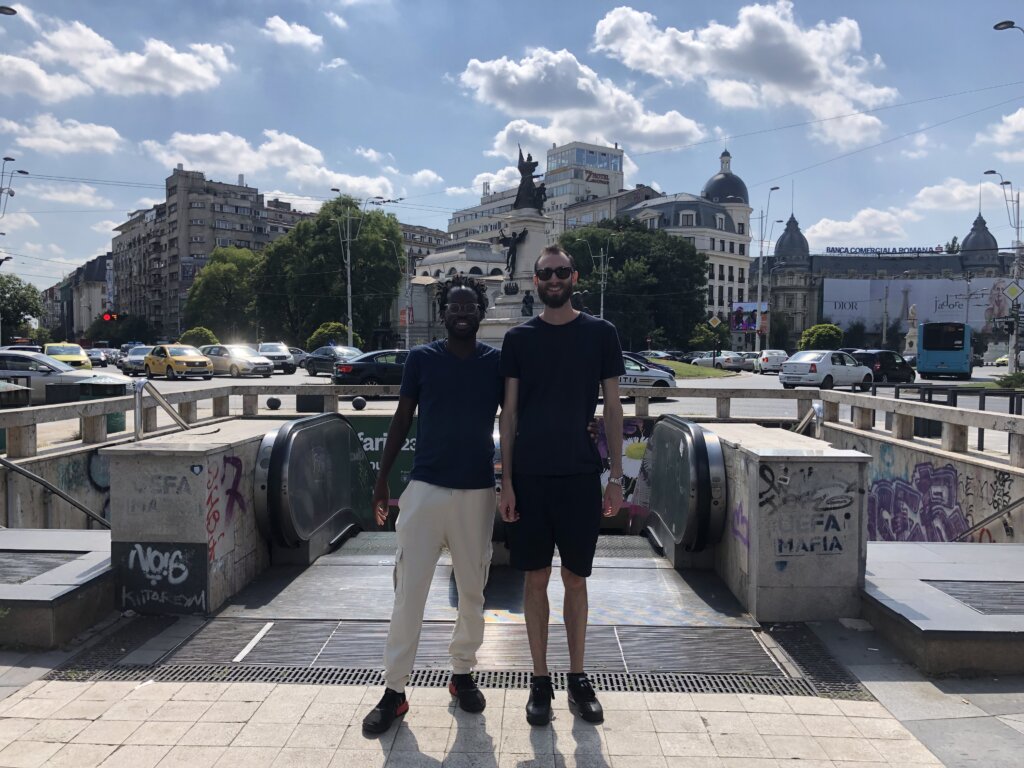 Edward Sturm with Kobe Osei Akoto at the Universitate train station in Bucharest, Romania in 2022.