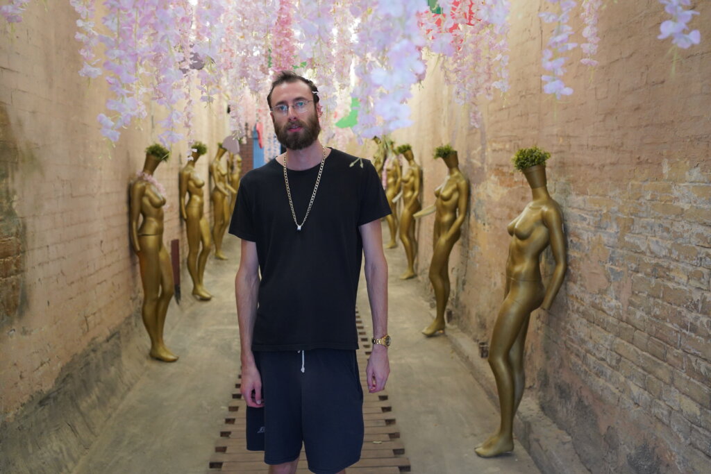 Edward Sturm in a gold chain at an art house exhibit in Kyiv, Ukraine. Photo taken in 2021.