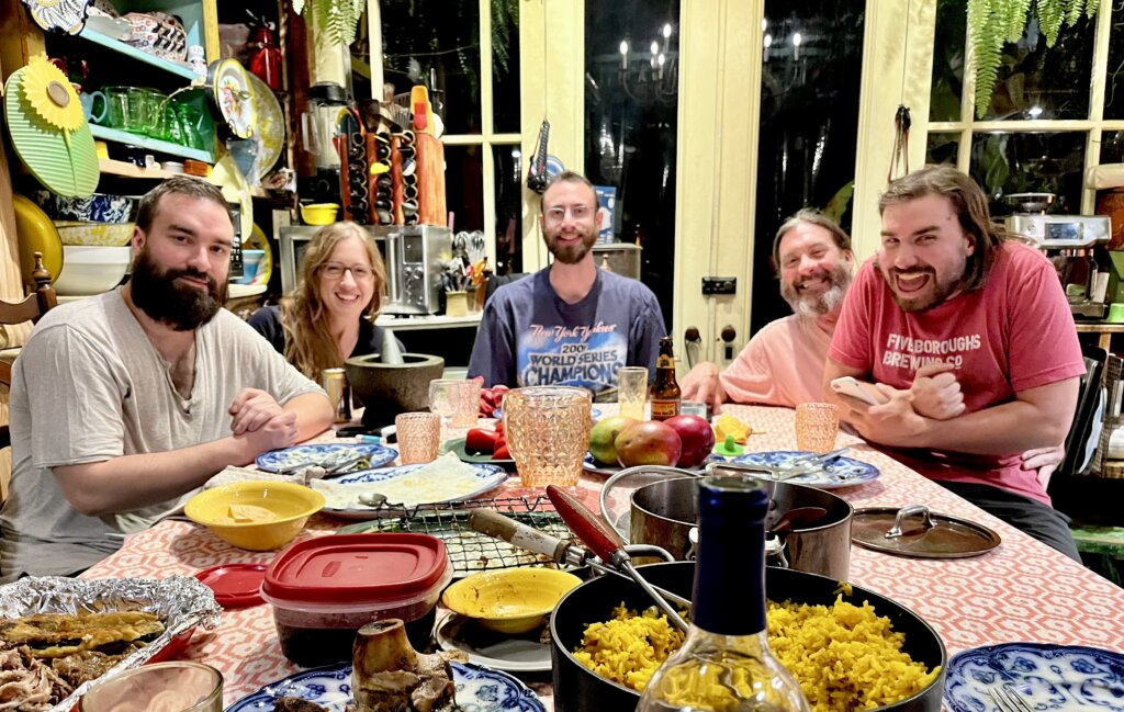 Edward Sturm and his friends, the Diller family. At a lush dining table. Photo taken in 2023 in Brooklyn, NYC.