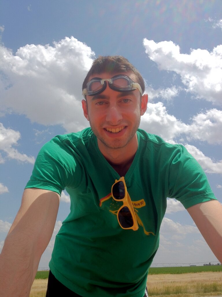 Edward Sturm on a highway in Kansas during the Gumball 3000. Edward is wearing goggles and sunglasses. Photo taken in 2012.