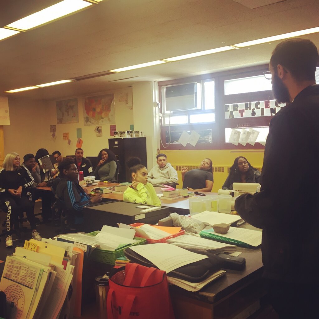 Edward Sturm speaking to a class at Research and Service High School in Brooklyn, NYC in 2018.