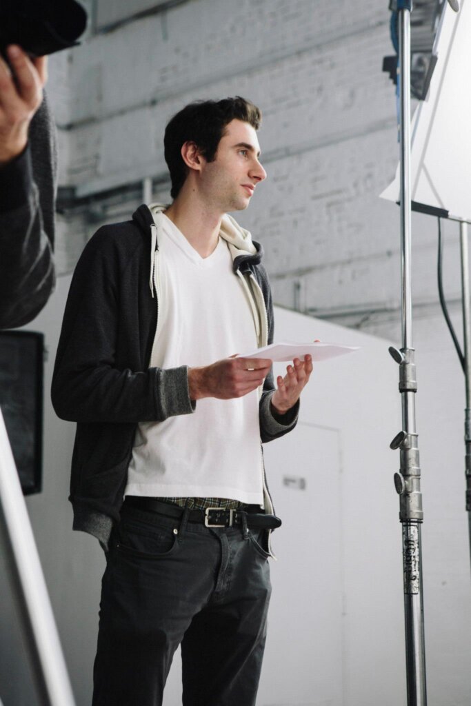 Edward Sturm in a hoodie, directing on the set of "Millennial High Art" in New Jersey, 2014.