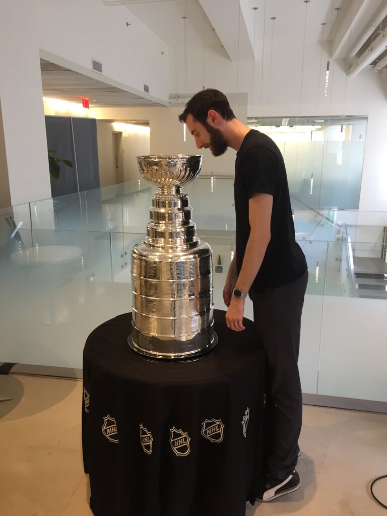 Edward Sturm looking into the NHL Stanley Cup. Taken at iProspect in Midtown, NYC 2017.