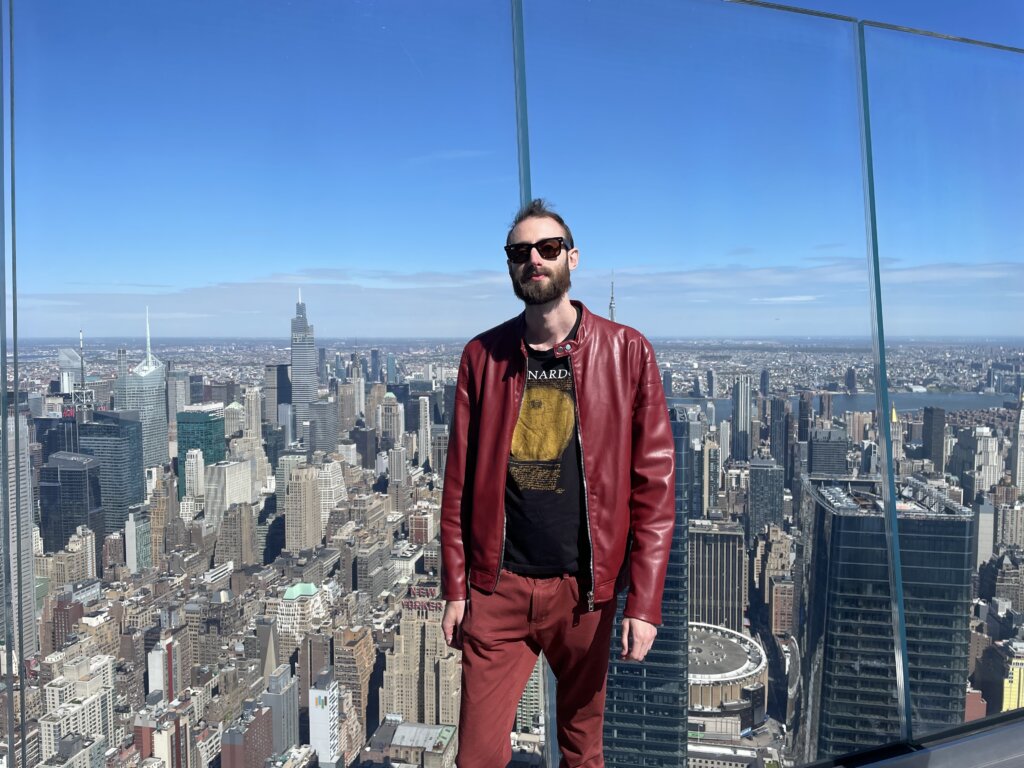 Edward Sturm in a red leather jacket at The Edge in NYC in 2022.