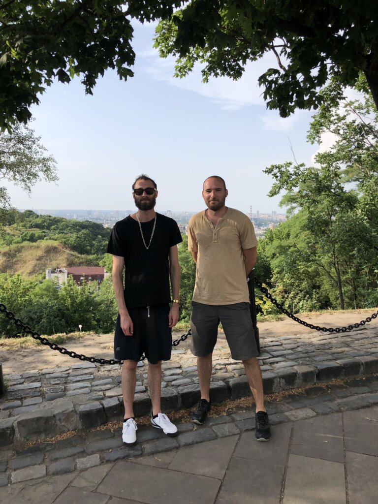 Edward Sturm in a gold chain with Yuriy Chernin at Volodymyrska Hill in Kyiv, Ukraine in 2021.