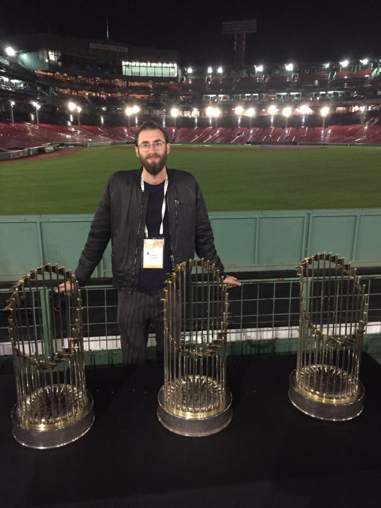 Edward Sturm at the Forbes Under 30 Summit with Boston Red Sox World Series Trophies. Photo taken at Fenway Park in Boston, 2017.